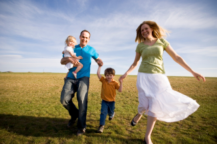 Happy Family in a grassy field